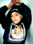 Female model wearing Trap & Nap Polaroid Hoodie — street style